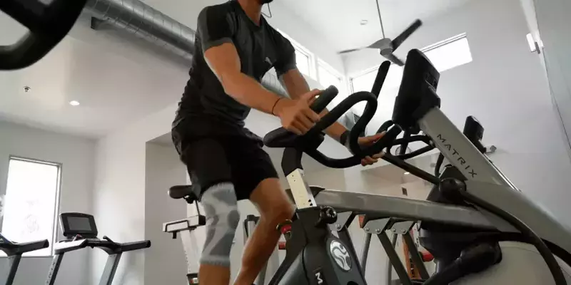 Person on exercise bike wearing Compressa